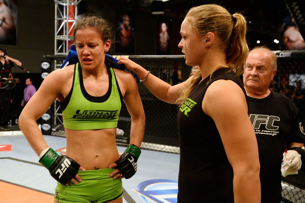 Shayna Baszler (left) and Ronda Rousey on the set of The Ultimate FighterAl Powers/Zuffa LLC/Getty Images