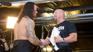 Steve Austin The Undertaker - https://www.wwe.com/gallery/stone-cold-steve-austin-and-undertaker-photos#fid-40399475